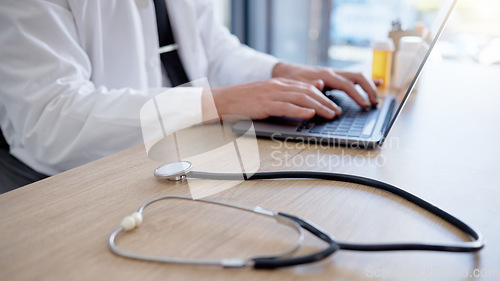 Image of Closeup, hands and doctor typing, stethoscope and telehealth in office, update data and connection for communication. Healthcare, zoom and man with digital planning, online schedule and research