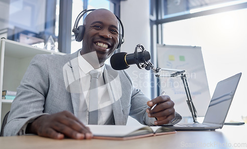 Image of Portrait, microphone and man on laptop for radio, podcast or business influencer in studio, happy and excited. Face, talk show and host by black guy streaming creative, finance and live audience