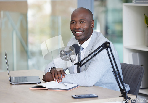 Image of Podcast, portrait and black man with microphone, radio broadcast or content creation in office, laptop and planning. Virtual reporter, news speaker or journalist speaking on live streaming audio show