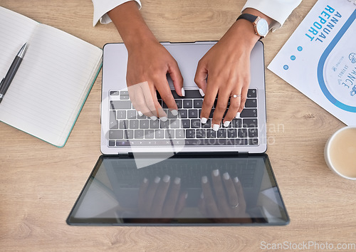 Image of Laptop, hands and business woman typing while doing research for a corporate project in her office. Technology, desk and professional female working on the computer keyboard for a company report.
