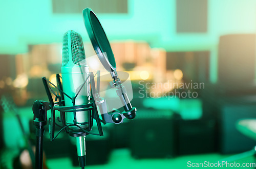 Image of Music, audio and microphone for a singer, musician or artist in a studio for a performance. Podcast, radio and equipment for sound production, singing and musical entertainment in an empty room