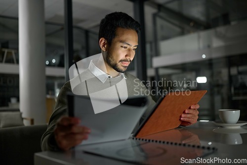 Image of Businessman, tablet and analytics working at night for planning, documents or online research at office. Male employee with touchscreen in analysis, strategy or project plan for evening at workplace