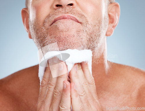 Image of Skincare, old man and towel to dry beard, dermatology and washing with guy on grey studio background. Face cleaning, senior citizen an mature male with hair care, beauty and cosmetics on backdrop