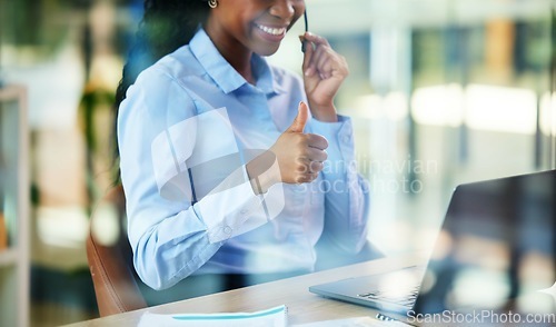 Image of Call center, video call and thumbs up with a business black woman consulting using a laptop for remote work. Customer service, hand and solution with a female consultant saying thank you in an office