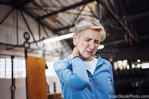 Image of Neck pain, senior woman and injury in gym after exercise, workout or training accident. Sports, wellness and elderly female with fibromyalgia, inflammation or painful muscles after exercising alone.