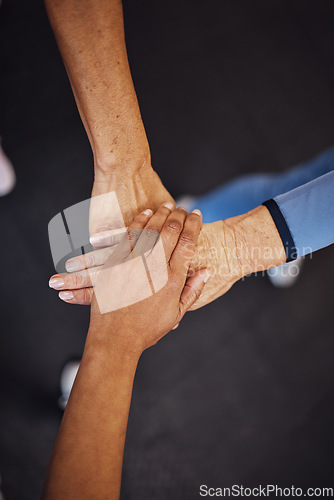 Image of Teamwork, top view and senior women hands together for team building, motivation and unity. Support, collaboration and group of elderly friends huddle for trust, union or solidarity, goals or targets