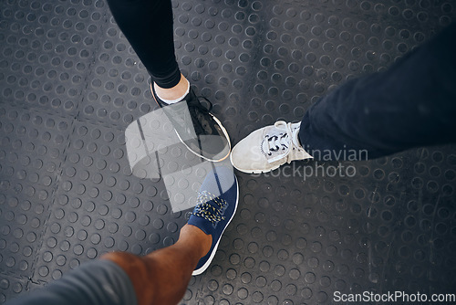 Image of Group fitness, feet and shoes of people together at gym for exercise, training and a workout together. Above sneakers of men at gym for health and wellness with motivation, teamwork and sports