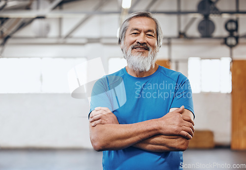 Image of Motivation, fitness and portrait of Asian man in gym with crossed arms for muscles, wellness and cardio workout. Smile, healthy body and face of senior male after training, exercise and sports goals