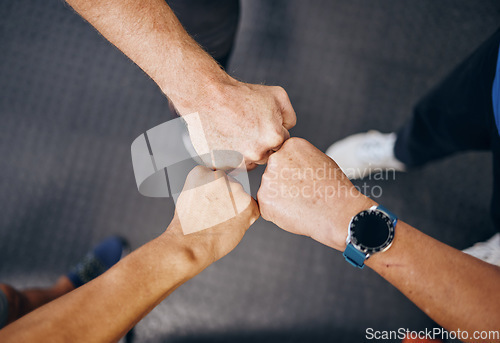 Image of Fist bump, motivation in workout in gym, training or exercise for strong muscles, healthcare or wellness. Top view, hands or men support in teamwork, collaboration or community in fitness diversity