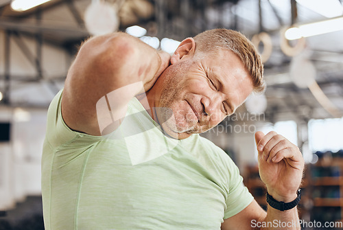 Image of Neck pain, fitness and bodybuilder man in gym for training, workout and challenge exercise with medical risk. Injury, muscle and strong person or athlete with sports accident, arthritis or shoulder