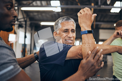 Image of Elderly man, gym and stretching with personal trainer for health, wellness and training with smartwatch. Men, workout motivation and exercise together for goals, muscle development or body healthcare