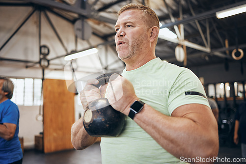 Image of Elderly man, gym and kettlebell at training for health, wellness and fitness with smartwatch. Senior bodybuilder workout, vision or exercise with group for goal, muscle development or body healthcare