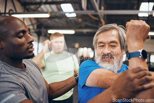 Image of Fitness, senior man and personal trainer with stretching support, bodybuilder helping and training in gym. Energy, real and elderly asian or people with lose weight community in workout or exercise