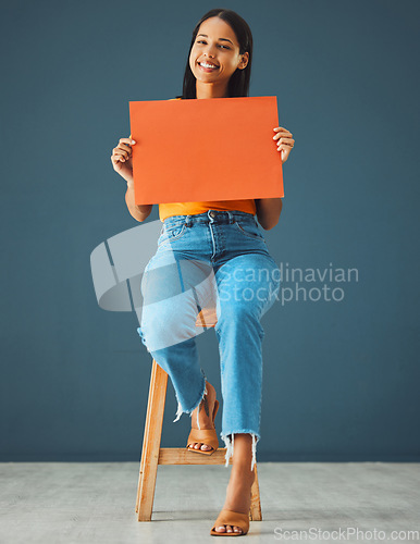 Image of Woman, banner portrait and mockup poster space for sale, discount or promotion. Happy model with advertising for product placement, logo or branding on billboard, orange paper sign, studio background