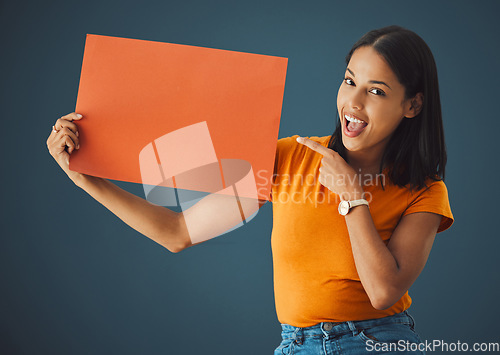 Image of Woman, poster portrait and wow mockup space for sale, discount or promotion. Model pointing or advertising product placement, logo or brand billboard on paper sign or banner in studio background