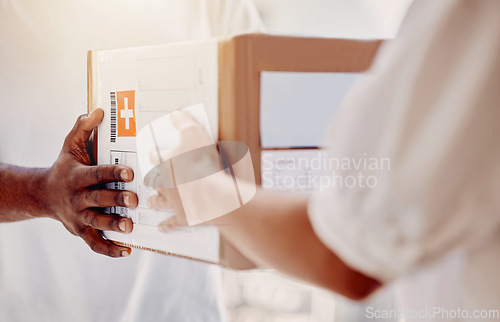 Image of Box, delivery and hands of courier man with a customer for ecommerce, orders and online shopping package. Hand, person and guy giving woman parcel, goods or retail product at the door of her home