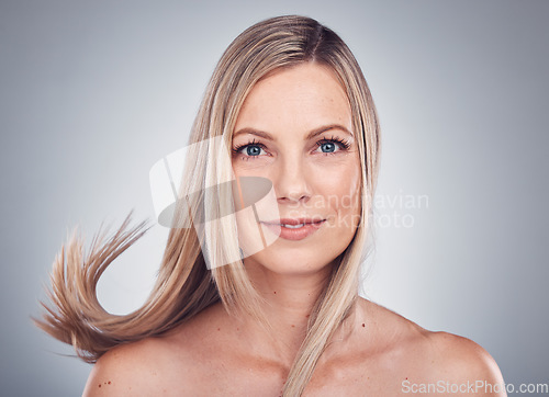 Image of Beauty portrait, hair care and woman in studio with natural makeup cosmetics and shampoo. Face of happy aesthetic model person on grey background for hairdresser or salon product for growth or shine