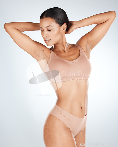 Image of Underwear, body and beauty woman isolated on a white background for skincare, natural cosmetics and aesthetic. Calm, relax and lingerie model or person in studio, dermatology results or hair removal