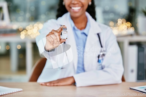 Image of Covid 19, vaccine and doctor hand for healthcare solution, compliance and happy insurance in office bokeh. Hospital, clinic and black woman for corona virus, vaccination bottle or product background