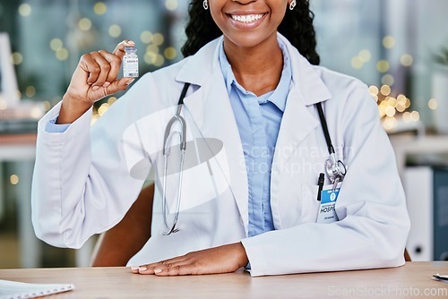 Image of Covid, vaccine and happy doctor for healthcare solution, compliance and insurance in office bokeh. Hospital, clinic or pharmacy black woman with corona virus in liquid bottle or product background
