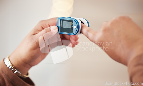 Image of Blood pressure, hand technology and isolated on wall background for healthcare check, diabetes or hypertension. Digital device mockup, easy self care and finger for medical check or test monitor