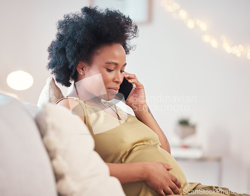 Image of Pregnant, phone call and black woman in home, talking or chatting to contact on living room sofa. Technology, pregnancy or future mom with mobile smartphone for networking, conversation or discussion