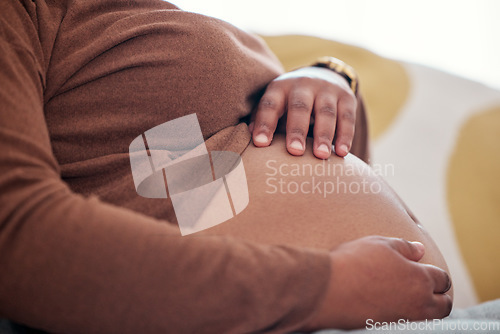 Image of Pregnancy, maternity and woman touching her belly to play with baby bump in her house. Prenatal, love and pregnant African female holding her stomach for motherhood, maternal love and care at home.