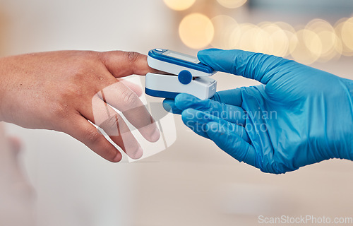 Image of Digital pulse device on finger, doctor checkup in hospital and close up of blood oxygen level measurement. Testing for diabetes in clinic, monitor bodys health with instrument and healthcare expert