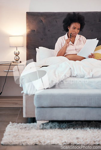Image of Black woman, pregnant and bed with paperwork, thinking or writing letter for maternity leave at home. African American female with pregnancy papers contemplating document or schedule plan in bedroom