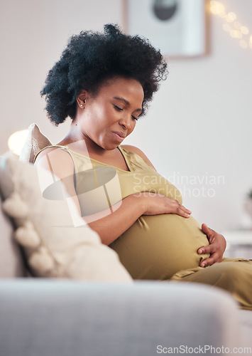 Image of Pregnant, sofa and black woman hands with hope feeling relax and mother love. Mom care, couch and living room lounge with a person holding abdomen happy about pregnancy lifestyle and baby in a house