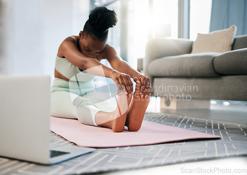 Image of Yoga, stretching and black woman in online class for fitness, pilates training and home learning on laptop. Meditation, workout and person in living room with computer video or webinar for balance