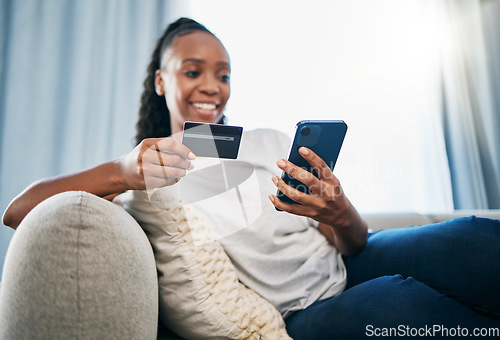 Image of Credit card or black woman with phone for online shopping or payment, internet purchase or ecommerce in living room. Fintech, happy or girl on smartphone for trading, banking or invest on home sofa
