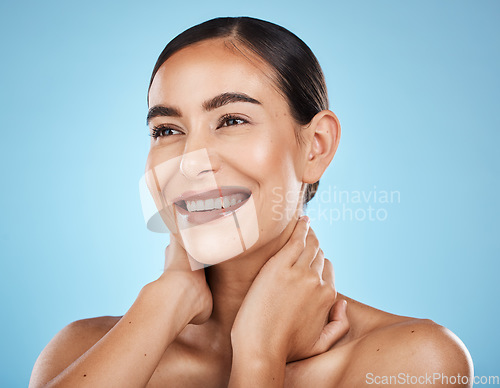 Image of Woman, face and smile, happy and facial with natural cosmetics and beauty isolated against blue background. Clean, cosmetic care and hands with glow, makeup and healthy skin with skincare in studio