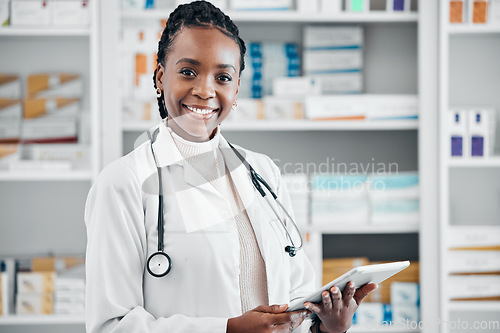 Image of Black woman, pharmacist portrait and tablet for pills stock and health data for wellness. Happy, pharmacy worker and smile of a pharmaceutical consultant with technology ready for online storage job