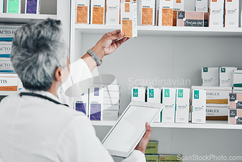 Image of Pharmacy, tablet and mockup with senior woman in store for healthcare, wellness or retail. Product, technology and prescription with pharmacist and medicine stock for shopping, medical or inventory