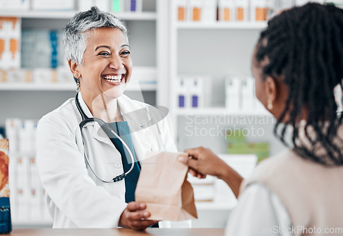 Image of Happy senior pharmacist with medicine for a black woman for retail healthcare treatment or consultation. Consulting, trust or mature doctor helping a customer shopping for medicine, pills or drugs