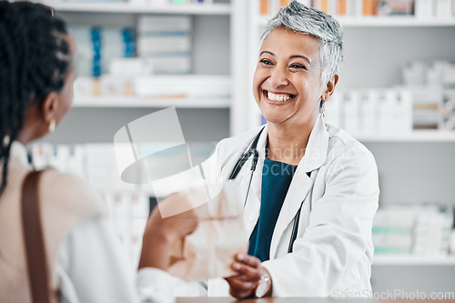 Image of Senior pharmacist with pills for a sick black woman in a pharmacy for retail healthcare treatment. Smile, trust or happy mature doctor helping a customer shopping for medication, medicine or drugs