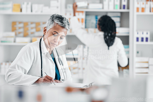 Image of Healthcare, notes and pharmacist writing paperwork for medicine, stock checklist and inventory. Pharmacy, working and woman with a document for clinic pills, product and medical information at job