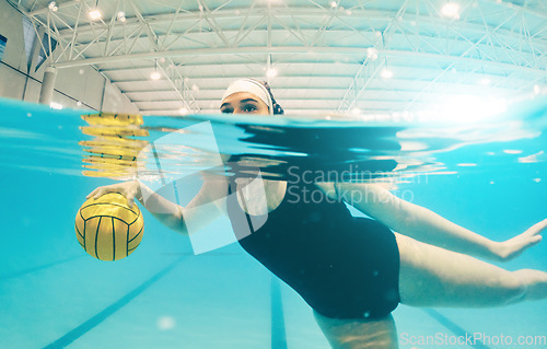 Image of Water polo, sports and woman in swimming pool for game, competition and match practice. Professional sport, fitness and girl athlete below aqua surface with ball for training, exercise and workout