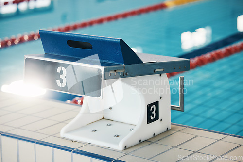 Image of Swimming, sports and podium number by pool for training, exercise and workout for triathlon competition. Fitness, motivation and three on empty starting board board for swimmer, diving and race