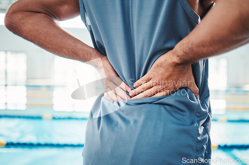 Image of Back pain, sports and hands of man by swimming pool with injury, muscle ache and inflammation. Wellness, support and athlete with accident, health problem or bruise from fitness, exercise or training