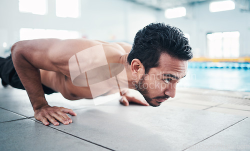 Image of Fitness, push up or man by a swimming pool training, workout or exercising for body goals with focus. Wellness, exercise or healthy young sports athlete with strong arms, endurance or motivation