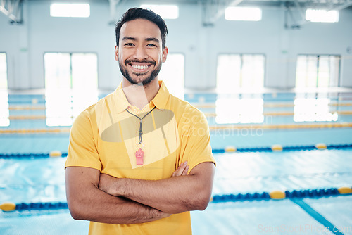 Image of Portrait, proud and coach at a swimming pool for training, exercise and practice at indoor center. Face, happy and personal trainer ready for teaching, swim and athletic guidance, smile and excited