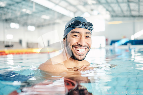 Image of Portrait, man and relax in swimming pool with cap in sports wellness, training or exercise for body healthcare. Workout, fitness and swimmer athlete with happy face, smile or water competition goals