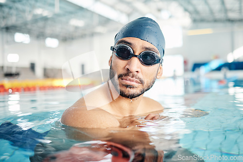 Image of Man, face or swimmer with pool cap, goggles or gear and sports vision, ideas or mindset in Asian water competition. Training, workout or exercise for swimming athlete with fitness goals or healthcare