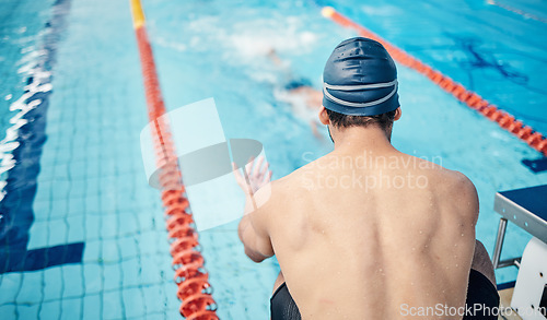 Image of Start, back and man at swimming training for fitness, health and sports body for a competition. Workout, motivation and man ready to swim in a professional water race, games or cardio in a pool