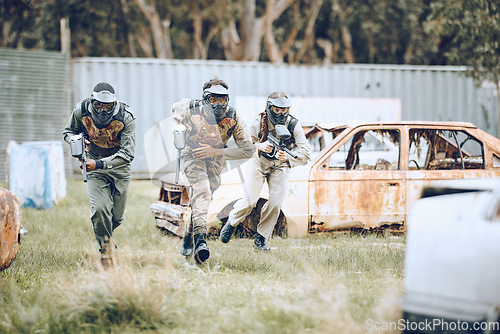 Image of Paintball, mission or men running in a shooting game playing with speed or fast action on a fun battlefield. Focus, military or players with guns or weapons for survival in an outdoor competition