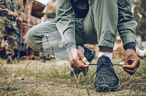 Image of Shoes, tie or hands in a paintball shooting game playing with speed or fast action on a fun battlefield. Mission focused, footwear or man ready to fight for survival in an outdoor war competition