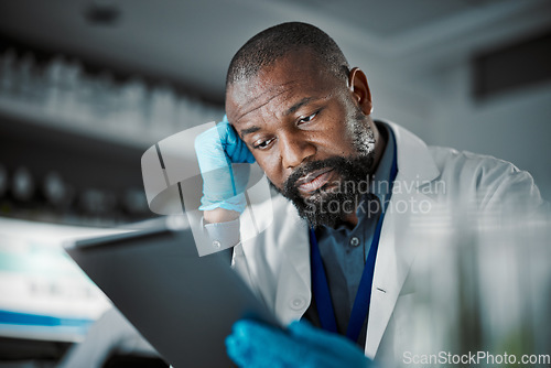 Image of Scientist man, stress and technology for medical research in a laboratory with slow internet. Science person or doctor frustrated at desk with fatigue, burnout and mental health working on tablet