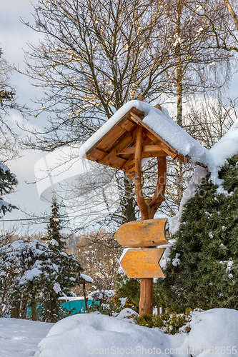 Image of beautiful signpost in winter garden